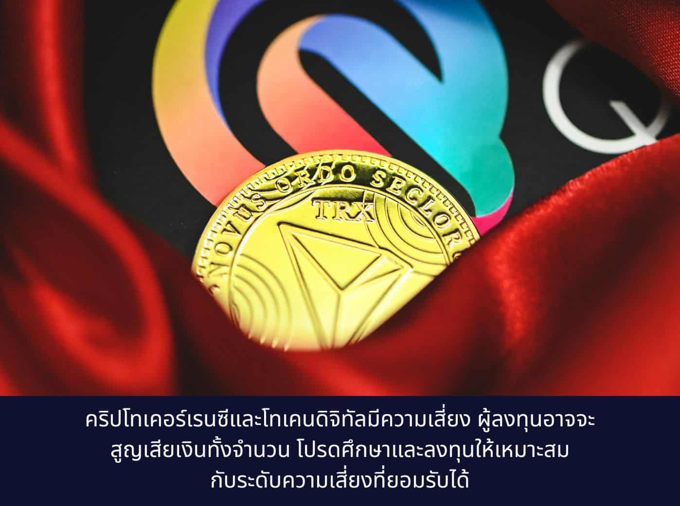 a close up of a gold coin on a red cloth